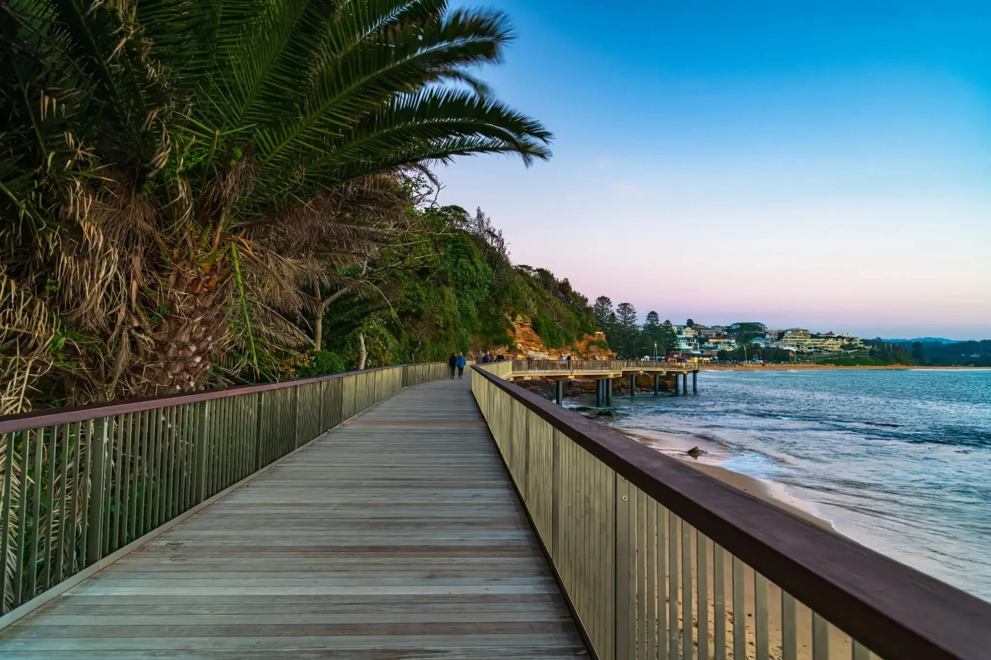 Terrigal Beach boardwalk at sunrise, with timber path running alongside the ocean on the NSW Central Coast