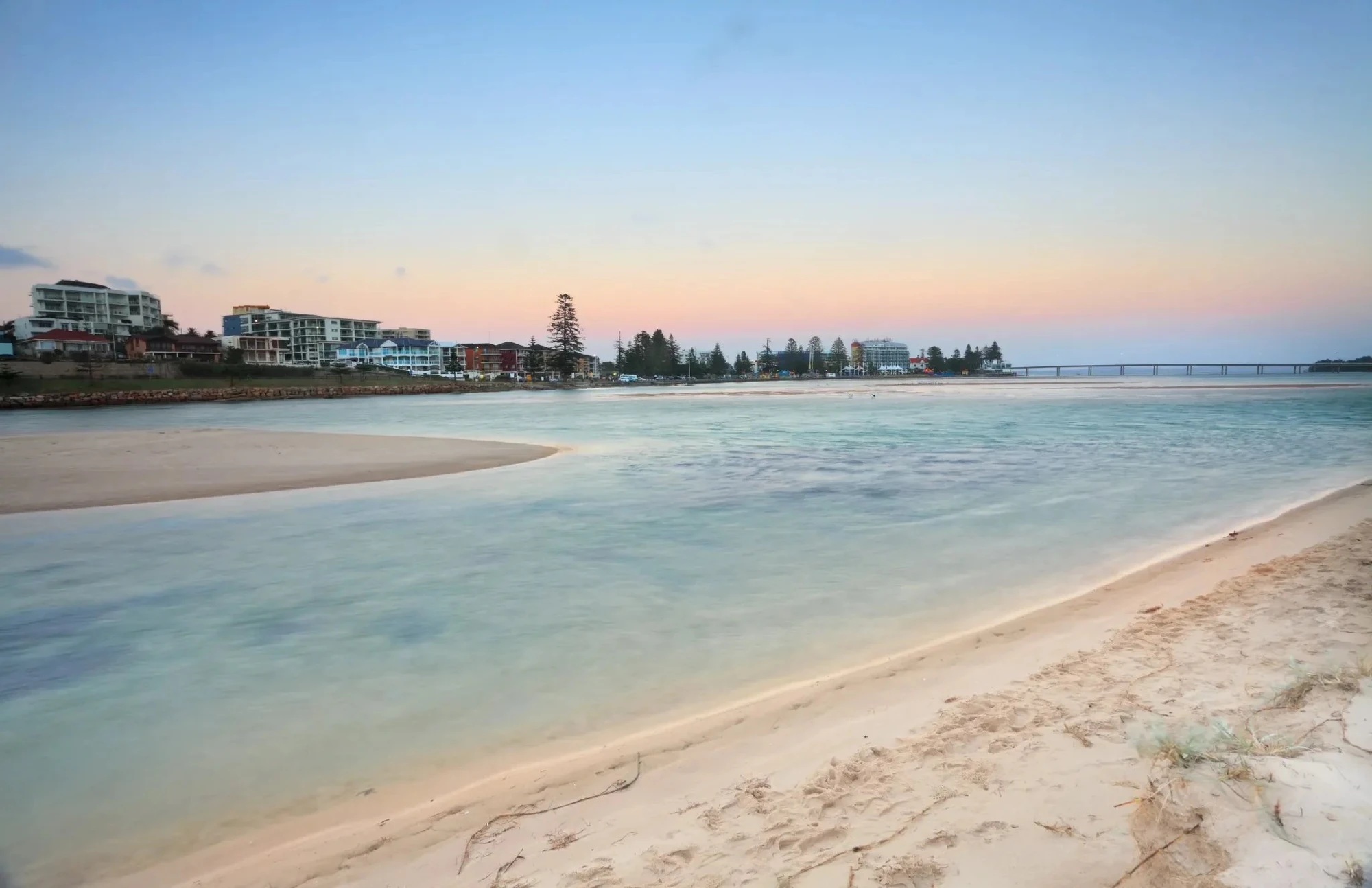 Soft sunrise light over Wamberal Lagoon on the NSW Central Coast